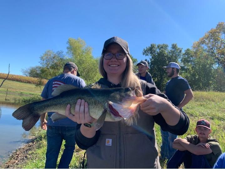Student poses with large fish